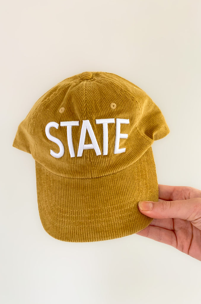 Show your Iowa State pride in style with this STATE ISU Embroidery Corduroy Baseball Cap. Showing your school spirit has never been this cute and comfy--it's made from soft corduroy and embroidered with the word "STATE" so everyone will know who you're rooting for. Go Cyclones!