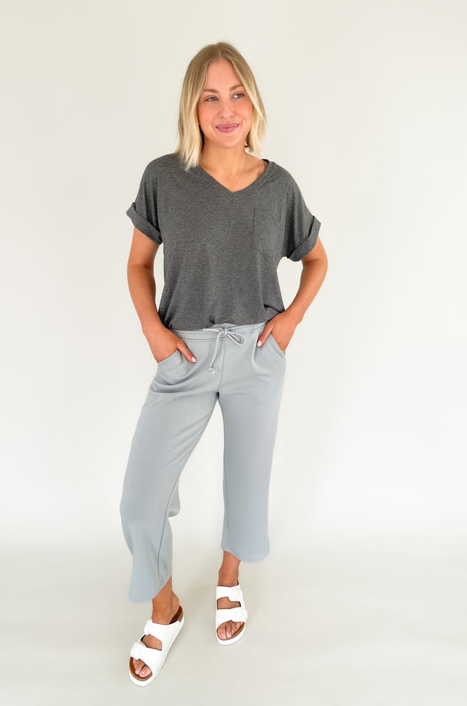 Stay comfortable and look stylish with the Scuba Crop Pant with Side Slits. Made from high-quality fabric, these relaxed-fitting pants feature an elastic drawstring waist and side slits at the ankle for enhanced comfort. The perfect choice for casual days all season long!