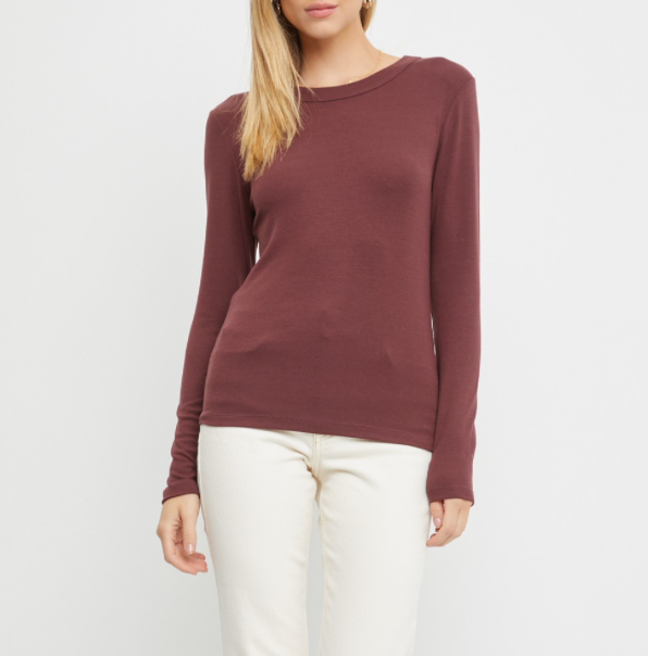 This classic Jen Round Neck Long Sleeve Knit Top is made of a soft fabric, ensuring comfort and style. It's great on its own, but the fitted silhouette makes it a great option for layering. The fabric is very soft and stretchy too. Perfect for any occasion, this piece is sure to become a staple in any wardrobe.