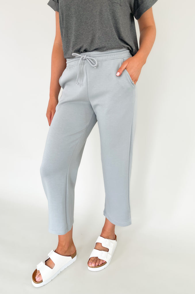 Stay comfortable and look stylish with the Scuba Crop Pant with Side Slits. Made from high-quality fabric, these relaxed-fitting pants feature an elastic drawstring waist and side slits at the ankle for enhanced comfort. The perfect choice for casual days all season long!