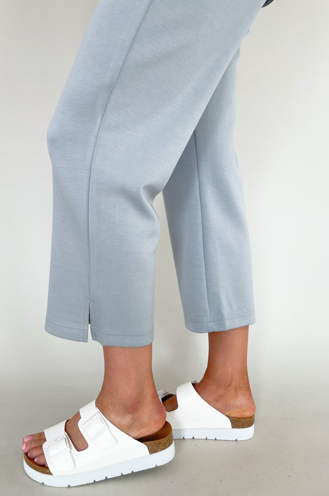 Stay comfortable and look stylish with the Scuba Crop Pant with Side Slits. Made from high-quality fabric, these relaxed-fitting pants feature an elastic drawstring waist and side slits at the ankle for enhanced comfort. The perfect choice for casual days all season long!