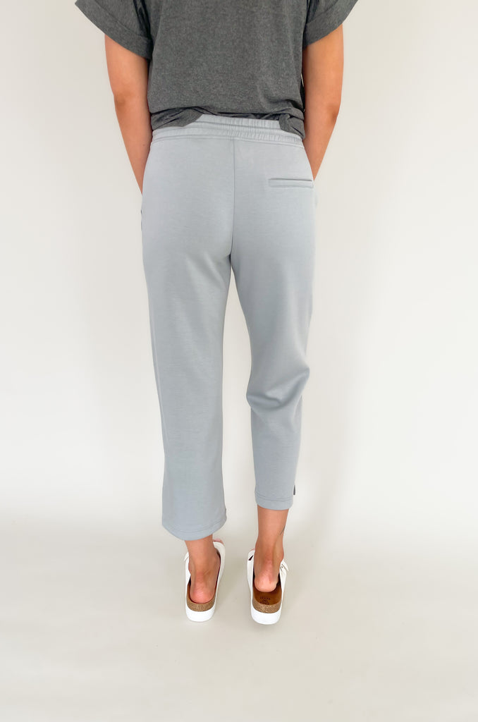 Stay comfortable and look stylish with the Scuba Crop Pant with Side Slits. Made from high-quality fabric, these relaxed-fitting pants feature an elastic drawstring waist and side slits at the ankle for enhanced comfort. The perfect choice for casual days all season long!