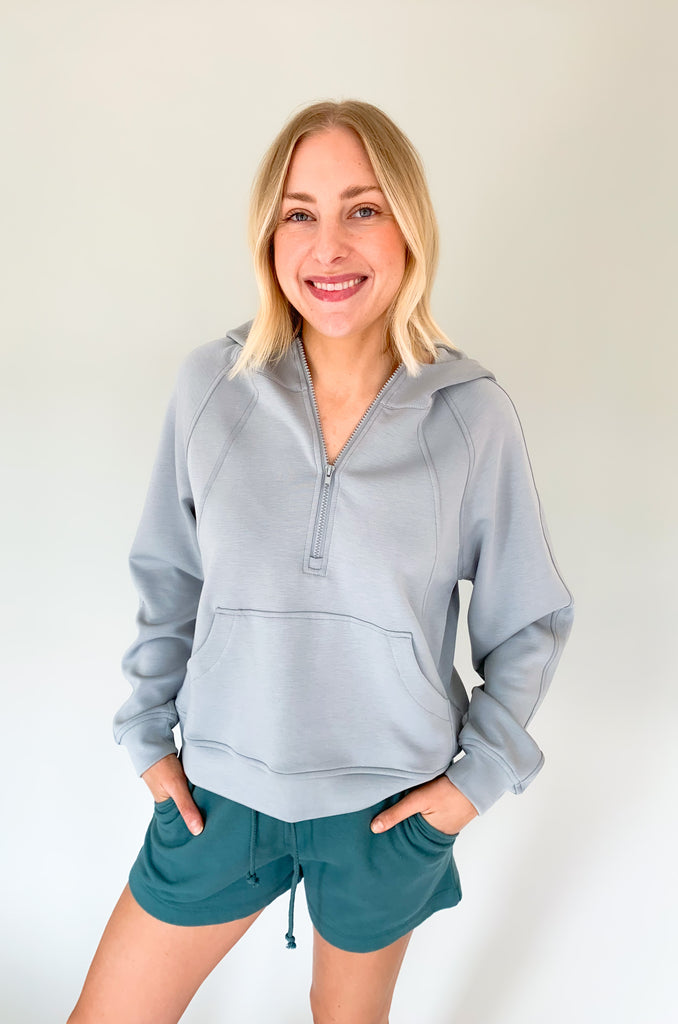 cloud colored hooded quarter zip with pouch pockets