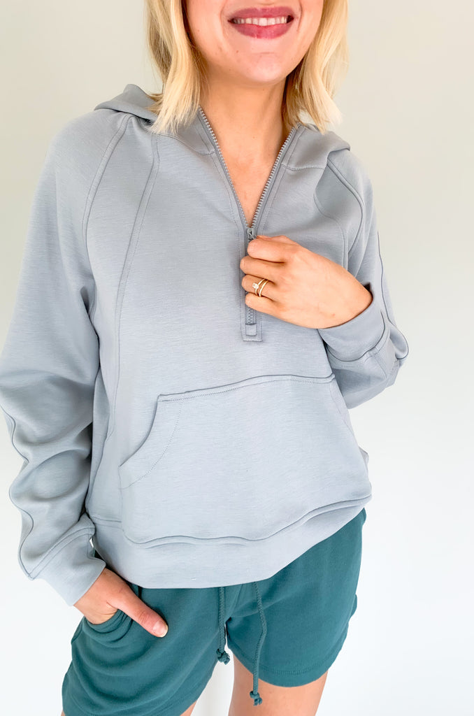 cloud colored hooded quarter zip with pouch pockets