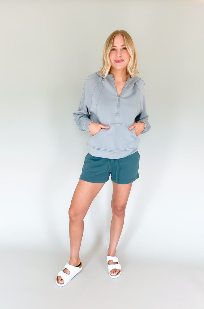 cloud colored hooded quarter zip with pouch pockets