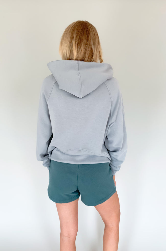 cloud colored hooded quarter zip with pouch pockets