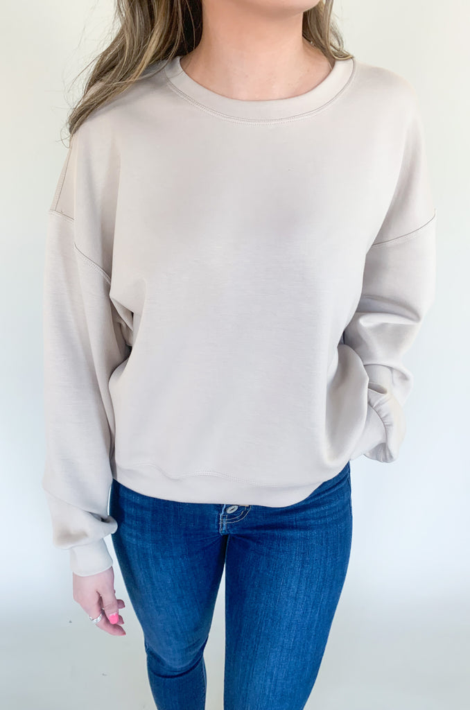 The Scuba Relaxed Cropped Sage Sweatshirt is the ultimate blend of style and comfort! Made from premium quality athletic-style fabric, this sweatshirt is designed to keep you comfortable and stylish throughout your day.