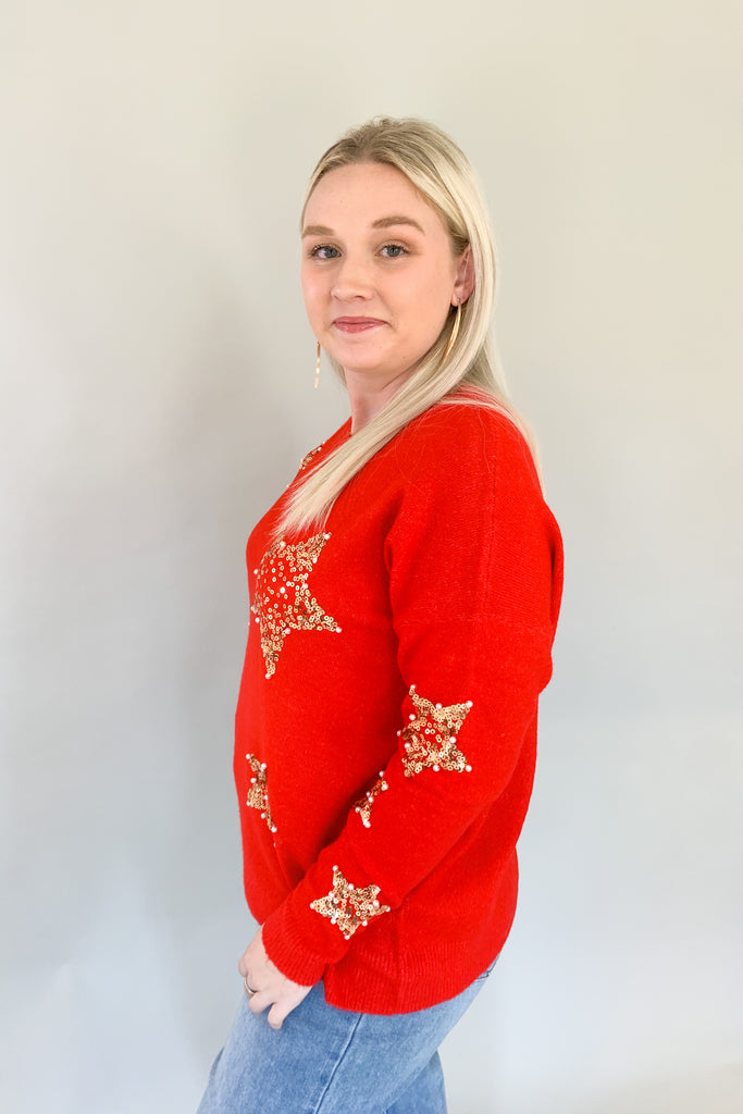 Look festive this season in our Sequin Star + Pearl Sweater! Enjoy the luxurious shade of classic red and sparkly sequins with a sprinkle of pearl accents. It's eye-catching and unique, so get ready for all the compliments! Featuring a round neckline and loose sweater body, this sweater has a very great fit. 
