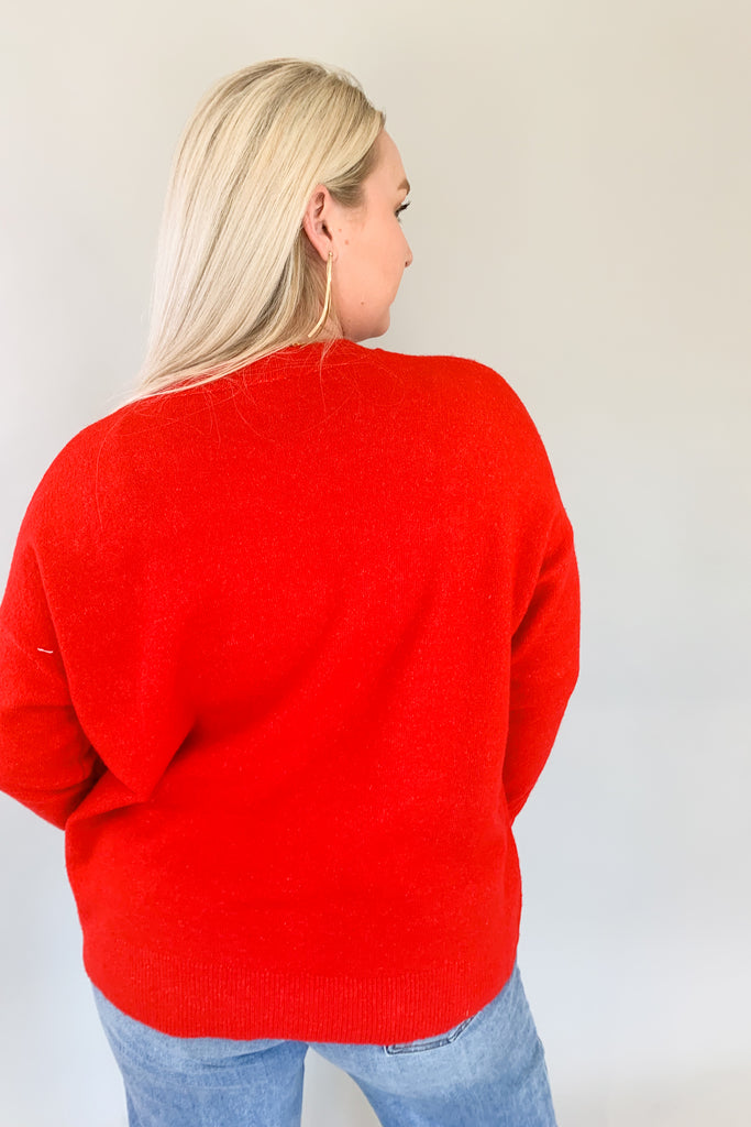 Look festive this season in our Sequin Star + Pearl Sweater! Enjoy the luxurious shade of classic red and sparkly sequins with a sprinkle of pearl accents. It's eye-catching and unique, so get ready for all the compliments! Featuring a round neckline and loose sweater body, this sweater has a very great fit. 