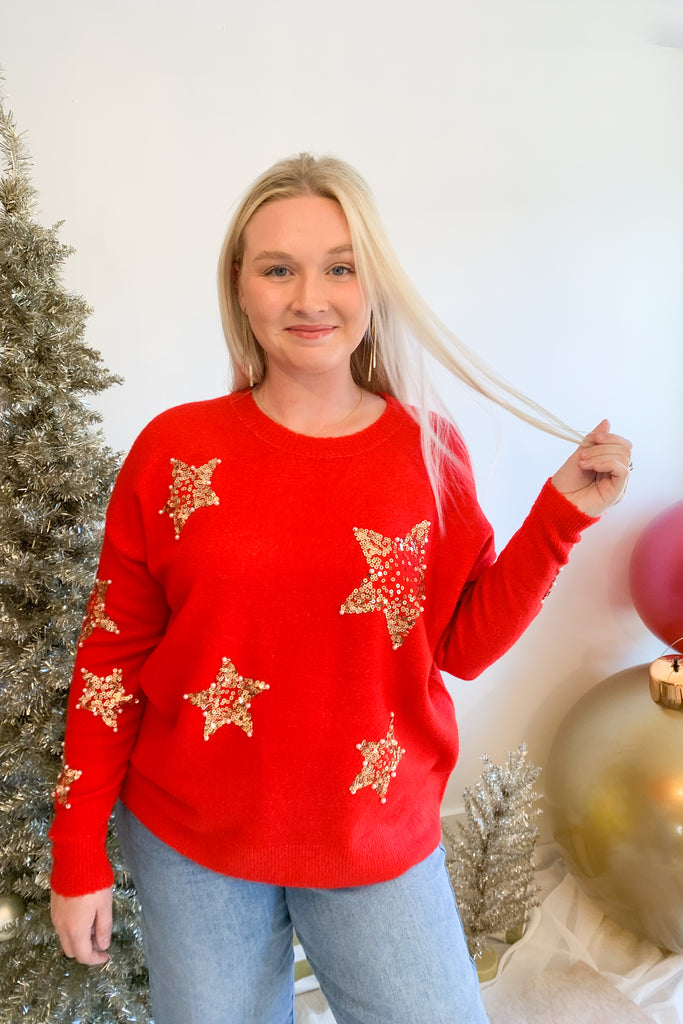 Look festive this season in our Sequin Star + Pearl Sweater! Enjoy the luxurious shade of classic red and sparkly sequins with a sprinkle of pearl accents. It's eye-catching and unique, so get ready for all the compliments! Featuring a round neckline and loose sweater body, this sweater has a very great fit. 