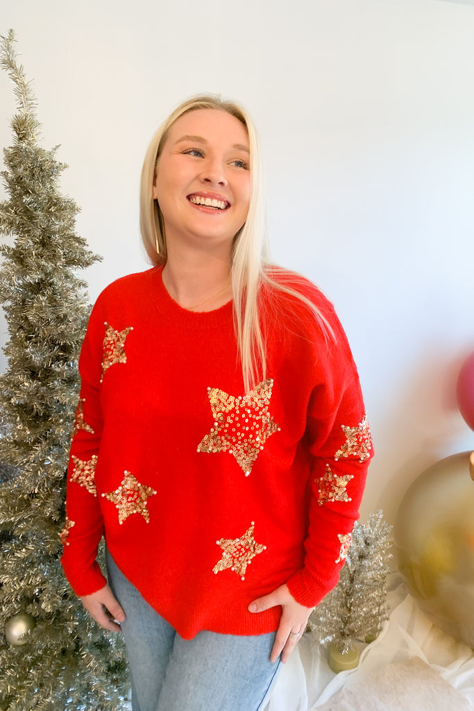 Look festive this season in our Sequin Star + Pearl Sweater! Enjoy the luxurious shade of classic red and sparkly sequins with a sprinkle of pearl accents. It's eye-catching and unique, so get ready for all the compliments! Featuring a round neckline and loose sweater body, this sweater has a very great fit. 