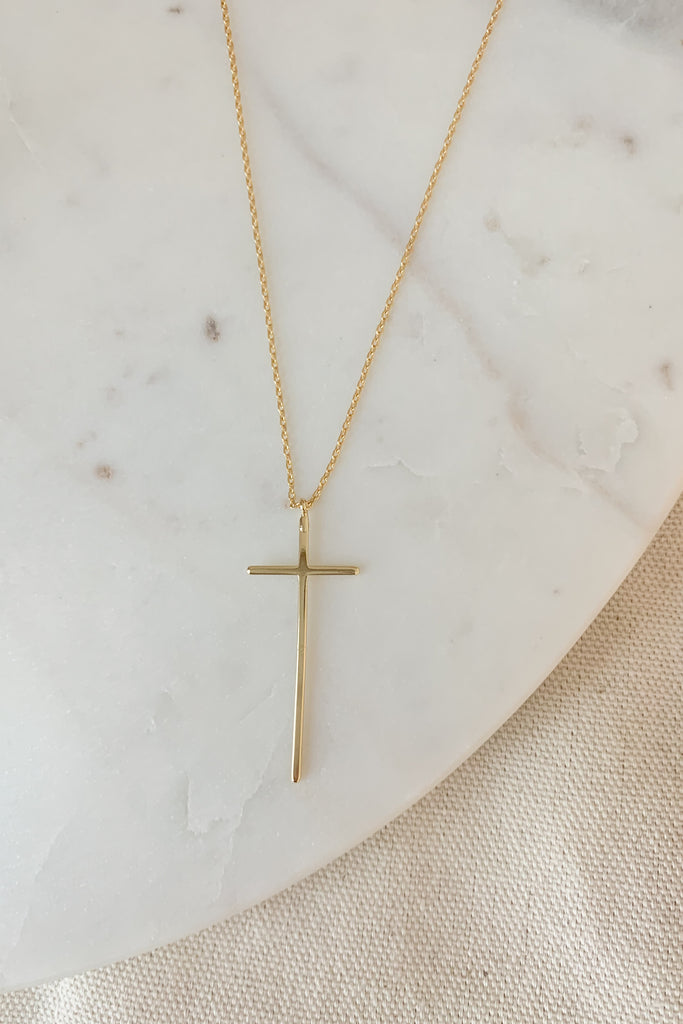 The Short Plain Long Cross Necklace is so pretty and timeless! It is gold dipped with a 15.5" gold chain and 2" extender. 
