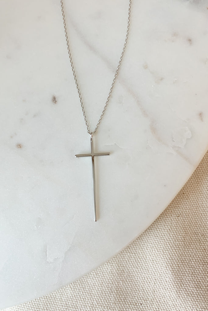The Short Plain Long Cross Necklace is so pretty and timeless! It is gold dipped with a 15.5" gold chain and 2" extender. 