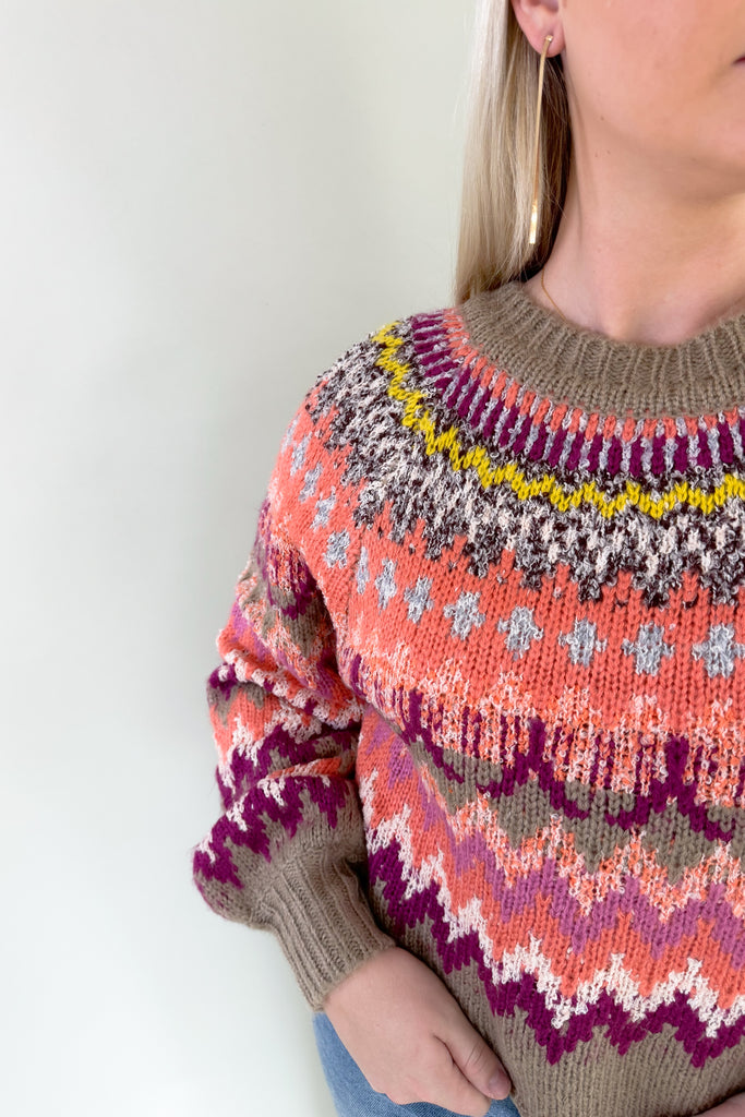 Refresh your wardrobe with the vibrant, textured knit Sia Fair Isle Multi Sweater! Made with abstract print stripes, it exudes confidence and playfulness. There is unique texture woven throughout too. The colors are so gorgeous with hints of purple, pink tones, and a pop of yellow. 