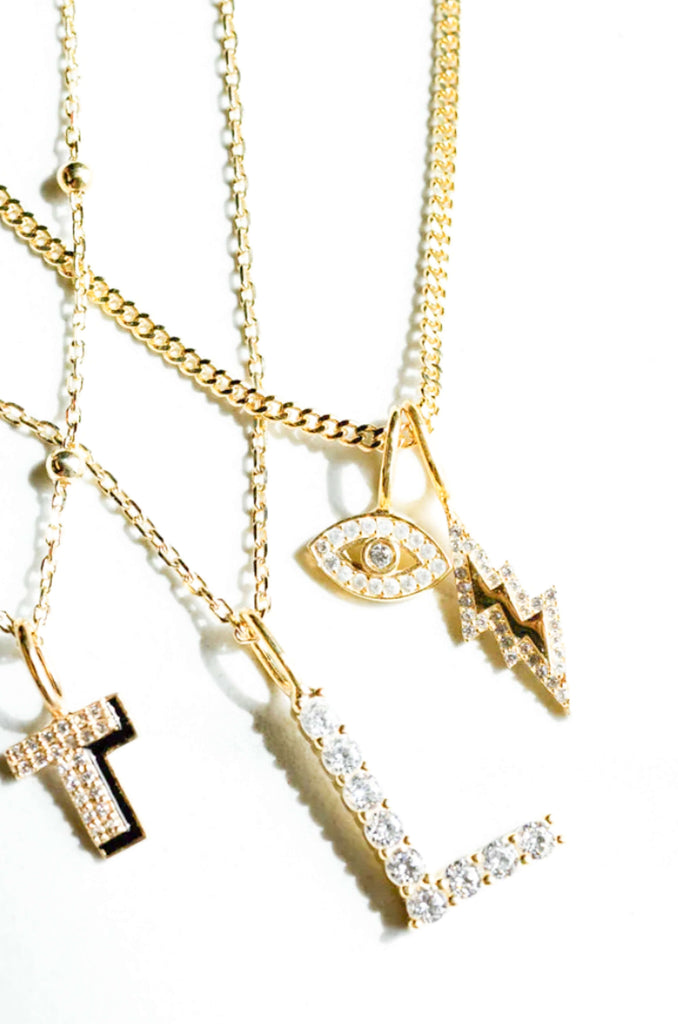 The Sis Kiss Mini Evil Eye Charm is so unique and fun! Choose between gold or silver to match back to your Sis Kiss Necklace. These necklaces are completely customizable with ability to add as many charms as you want. 