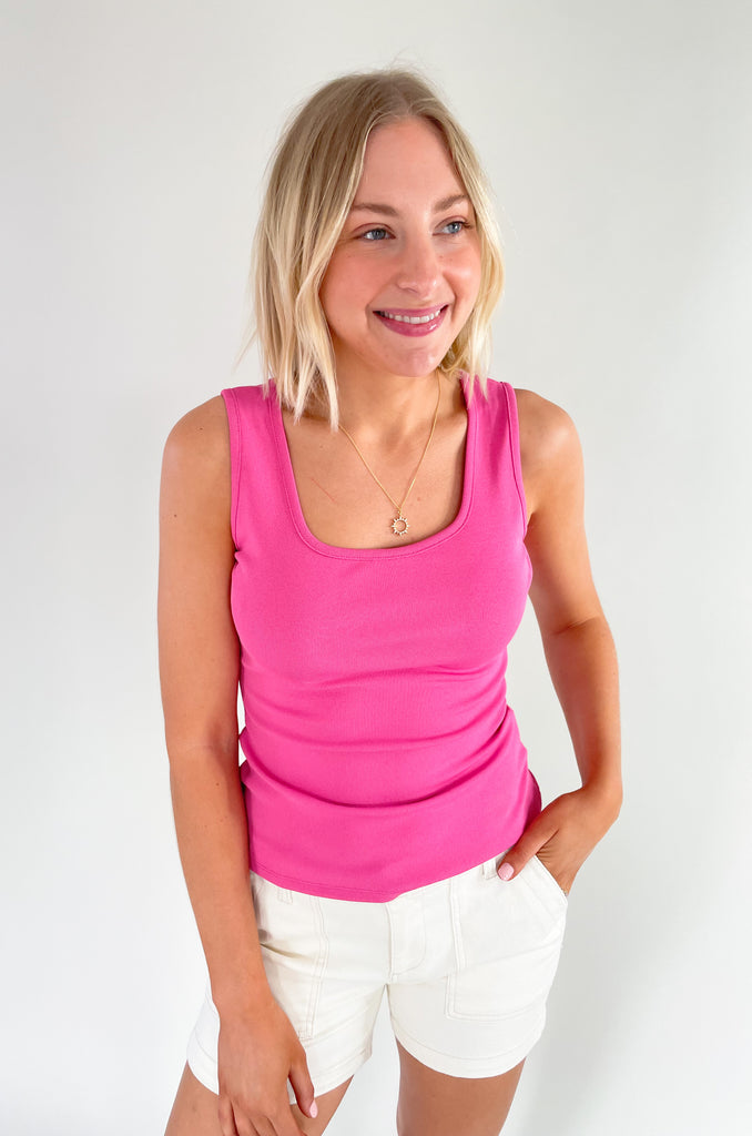 Square neck, white strap slinky tank top with elevated and stretchy fabric. Available in orange, pink, black or ivory. 