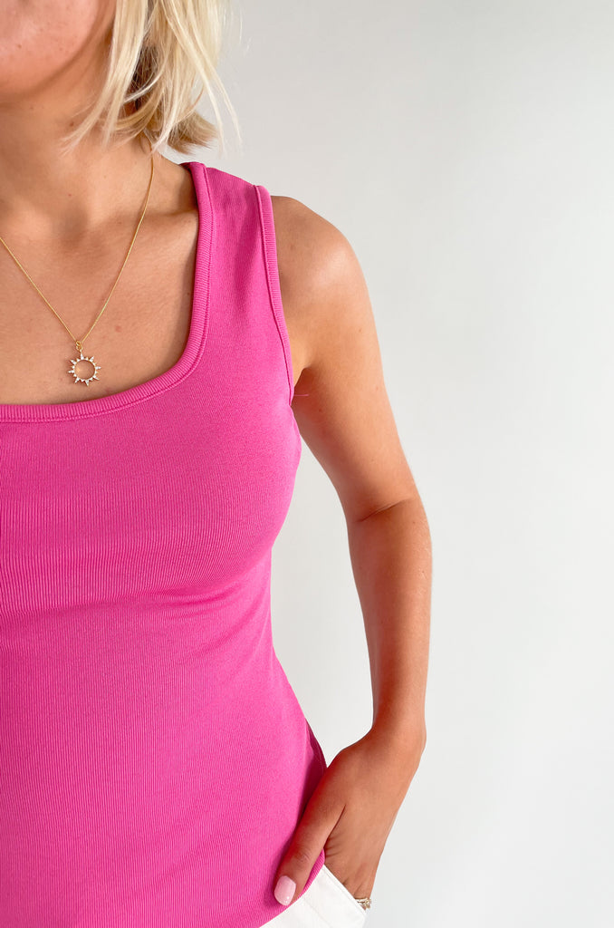 Square neck, white strap slinky tank top with elevated and stretchy fabric. Available in orange, pink, black or ivory. 