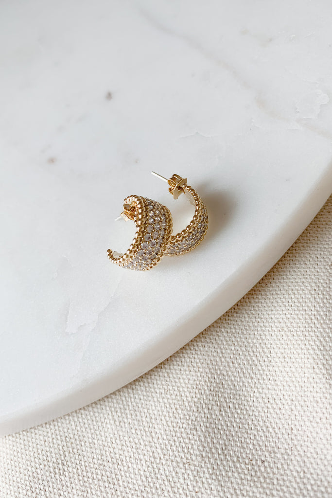 The Small Gold Hoop with Pave CZ takes a classic hoop and elevates it with a little sparkle. Because of the cubic zirconia stripe, you could pair these with either gold or silver jewelry. It's elevated, lightweight, and perfect for everyday. 