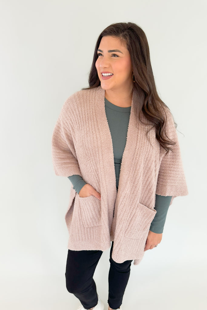 Stay warm and cozy in this Softies Rib Marshmallow Shawl! Its soft fabric and timeless style make it perfect for everyday wear, from naps to errands. We love the side slits and front pockets too. You could even belt it as another versatile way to wear this shawl. Enjoy a comfort and style upgrade this season!