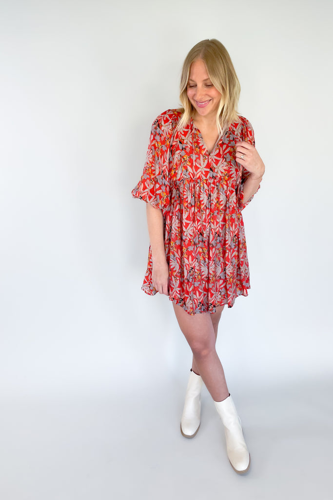 This mini dress will make a statement with its trendy red color and bold floral print! The Sophie Flowy Floral Mini Dress features a v-neckline, 3/4 balloon sleeves, and babydoll shape with flouncy bottom.