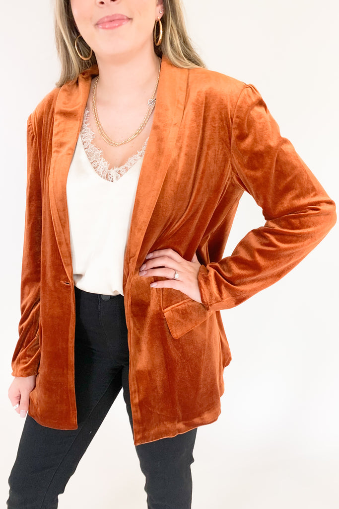 Make a statement in the Stella velvet blazer! With a timeless long-sleeve design and luxe velvet fabric, this blazer is a must-have for modern fashion lovers. Perfect for any occasion, but especially holidays. The versatility is endless too. Pull in colors of the teal blazer by pairing it with our Ecru Apricot Floral Long Sleeve Blouse, or pair anything with copper. 