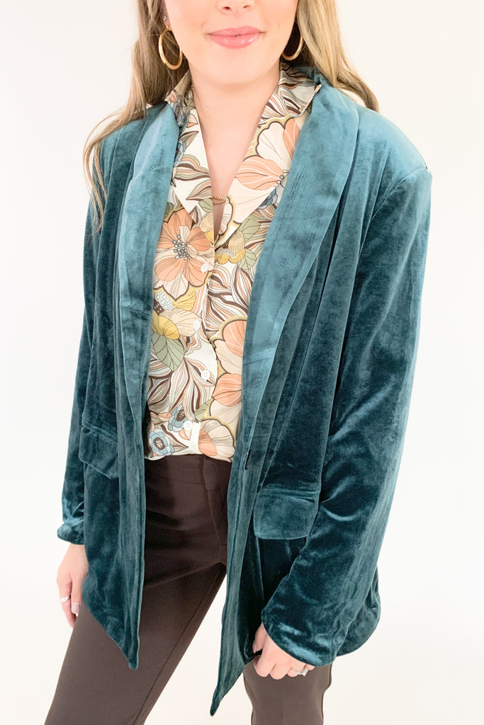 Make a statement in the Stella velvet blazer! With a timeless long-sleeve design and luxe velvet fabric, this blazer is a must-have for modern fashion lovers. Perfect for any occasion, but especially holidays. The versatility is endless too. Pull in colors of the teal blazer by pairing it with our Ecru Apricot Floral Long Sleeve Blouse, or pair anything with copper. 