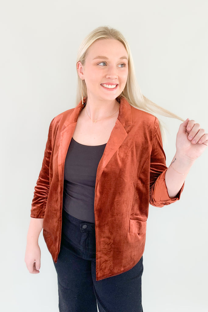 The Iris Velvet Blazer is a must-have! It is perfect for making a statement and hits the 70s trend we cannot get enough of this year. All of the details elevate this style. Although it is a fitted blazer, it is very stretchy and comfortable. The inside of each blazer has a stunning satin-like fabric with a floral design. It also has ruched 3/4 length sleeves and faux pockets. The Iris is timeless and truly a wow-piece! 