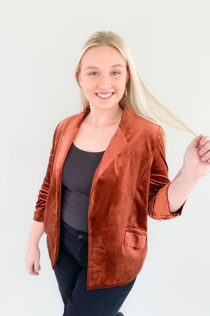 The Iris Velvet Blazer is a must-have! It is perfect for making a statement and hits the 70s trend we cannot get enough of this year. All of the details elevate this style. Although it is a fitted blazer, it is very stretchy and comfortable. The inside of each blazer has a stunning satin-like fabric with a floral design. It also has ruched 3/4 length sleeves and faux pockets. The Iris is timeless and truly a wow-piece! 