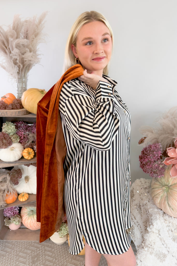 The Stripes on Stripe Button Up Shirt Dress is a fun style for fall and winter. The neutral stripes are timeless, making it a great wow-piece for the new season. The satin material is extremely soft and elevated too. If you want it more tailored, try adding a belt to complete your look! 