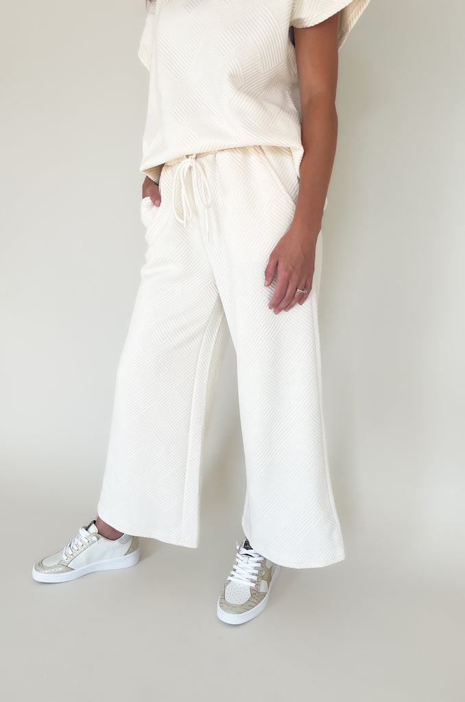 cropped textured wide leg long pants. Pairs perfectly with short sleeve sweater.  Available in taupe and cream