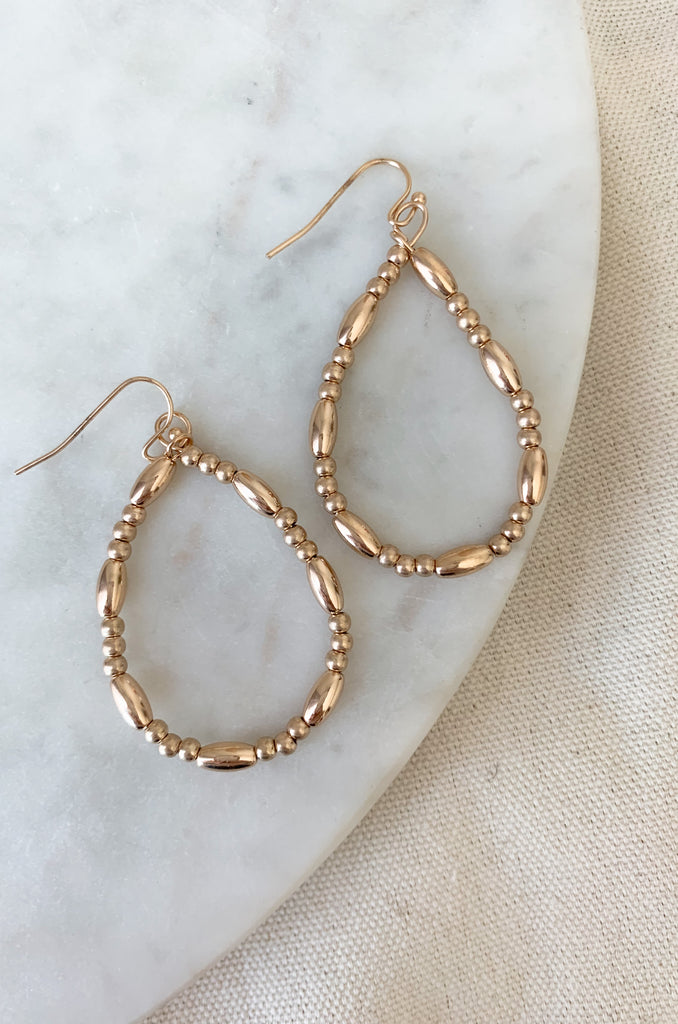 Make a fashion statement with these stylish and lightweight Teardrop Long & Ball Beaded Earrings. Available in gold, silver, and mixed metal, they feature a multilayered design with teardrop shaped accents and ball and oval beaded details. The perfect addition to any outfit!