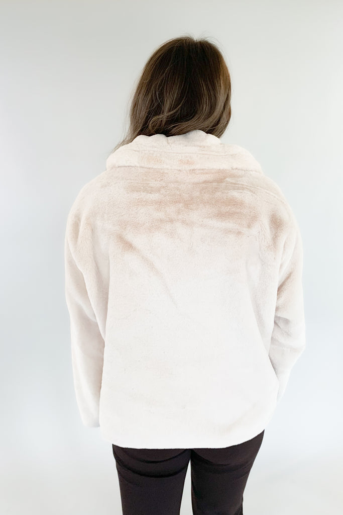 Stay warm and look great in the Teddy Cream Zip Jacket! Soft, creamy teddy material is perfectly paired with a satin lining for a stylish, yet cozy look. The front zip makes it hassle-free and perfect for any holiday occasion. 