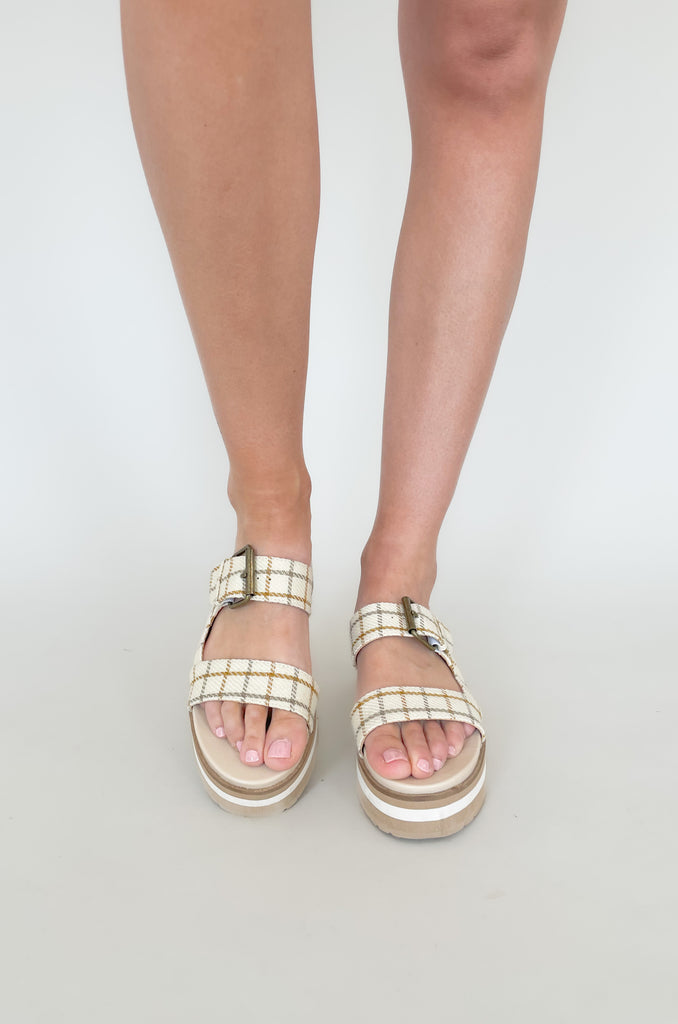 The Teresa Two Strap Platform Buckle Slide is super comfortable with fun plaid straps. It features double straps with a buckle adjustment and platform bottoms. These add a unique touch to any outfit!