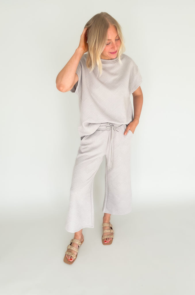 cropped textured wide leg long pants. Pairs perfectly with short sleeve sweater.  Available in taupe and cream