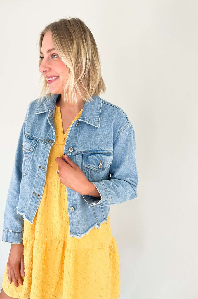 Feel like your best self while rocking this Dee Distressed Relaxed Denim Jacket! This fun denim jacket features long sleeves and a semi-cropped fit, plus raw hem details add a trendy touch to any outfit. It's the perfect weight that can be worn spring-fall, so you will get tons of wear out of it.