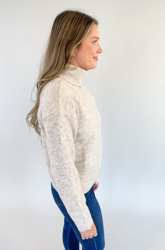 Stay warm and stylish this season with our Molly Bracken Turtleneck Drop Shoulder Sweater! Crafted with a textured, super soft fabric, this sweater features a classic, flattering fit, perfect for any wardrobe. Keep cozy and chic all season long.
