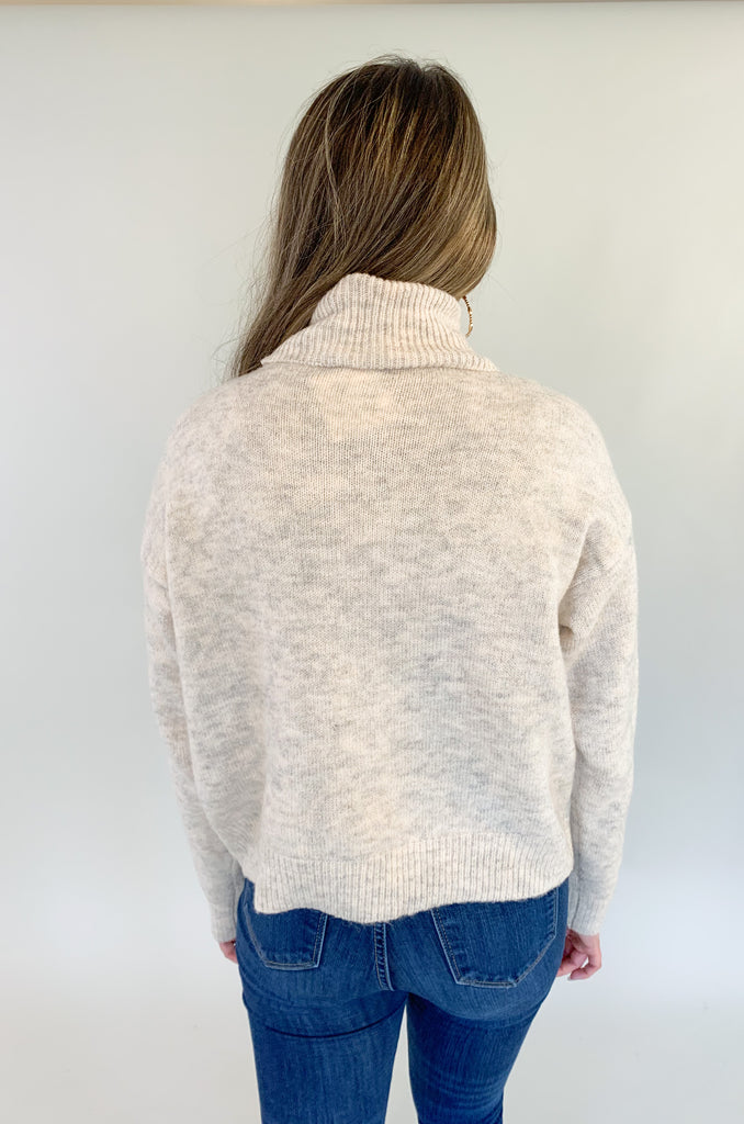 Stay warm and stylish this season with our Molly Bracken Turtleneck Drop Shoulder Sweater! Crafted with a textured, super soft fabric, this sweater features a classic, flattering fit, perfect for any wardrobe. Keep cozy and chic all season long.