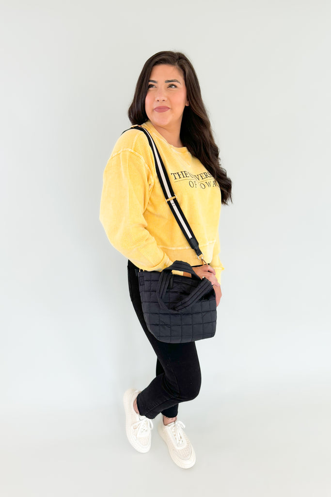 Stay cozy and show your team spirit with this fun University of Iowa Emblem Pullover! It features a unique, bright yellow corded material with block text, making it perfect for fans of the Hawkeyes. Look great and stay comfortable on game day, or snag one of these as a gift!