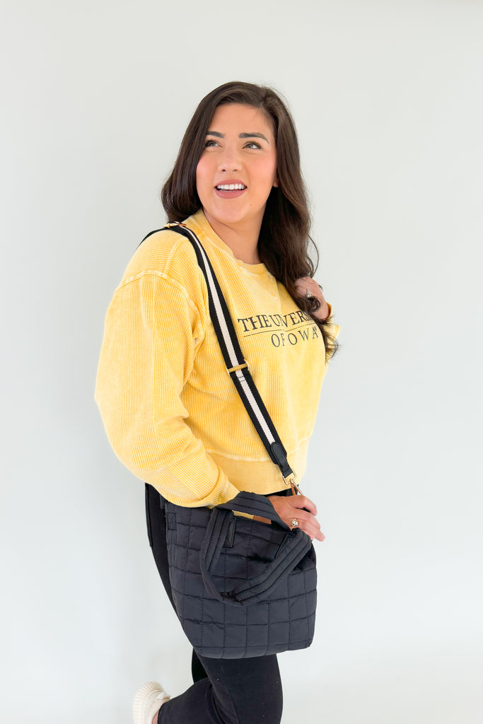 Stay cozy and show your team spirit with this fun University of Iowa Emblem Pullover! It features a unique, bright yellow corded material with block text, making it perfect for fans of the Hawkeyes. Look great and stay comfortable on game day, or snag one of these as a gift!