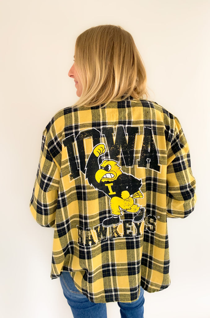 This University of Iowa Mascot Oversized Plaid Flannel is a must-have for any Iowa Hawkeyes fan! It's crafted from a classic, cozy flannel material that's soft and elevated. The oversized black and yellow plaid print screams Hawkeye fun! Plus, the Herky the Hawk Mascot logo makes this flannel extra special for game day.
