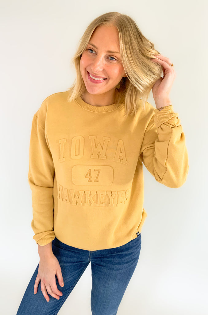 The U of I Vintage 81 Emboss Crewneck is designed with a fun, vintage-inspired look that's cute and cozy for game day! This classic crewneck features a raised embossed logo on the front that's so unique. You cannot find crewnecks like these just anywhere! Add some of our favorite Iowa accessories and you are ready for your next tailgate.