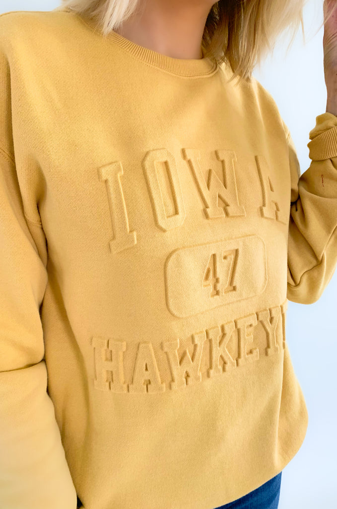The U of I Vintage 81 Emboss Crewneck is designed with a fun, vintage-inspired look that's cute and cozy for game day! This classic crewneck features a raised embossed logo on the front that's so unique. You cannot find crewnecks like these just anywhere! Add some of our favorite Iowa accessories and you are ready for your next tailgate.