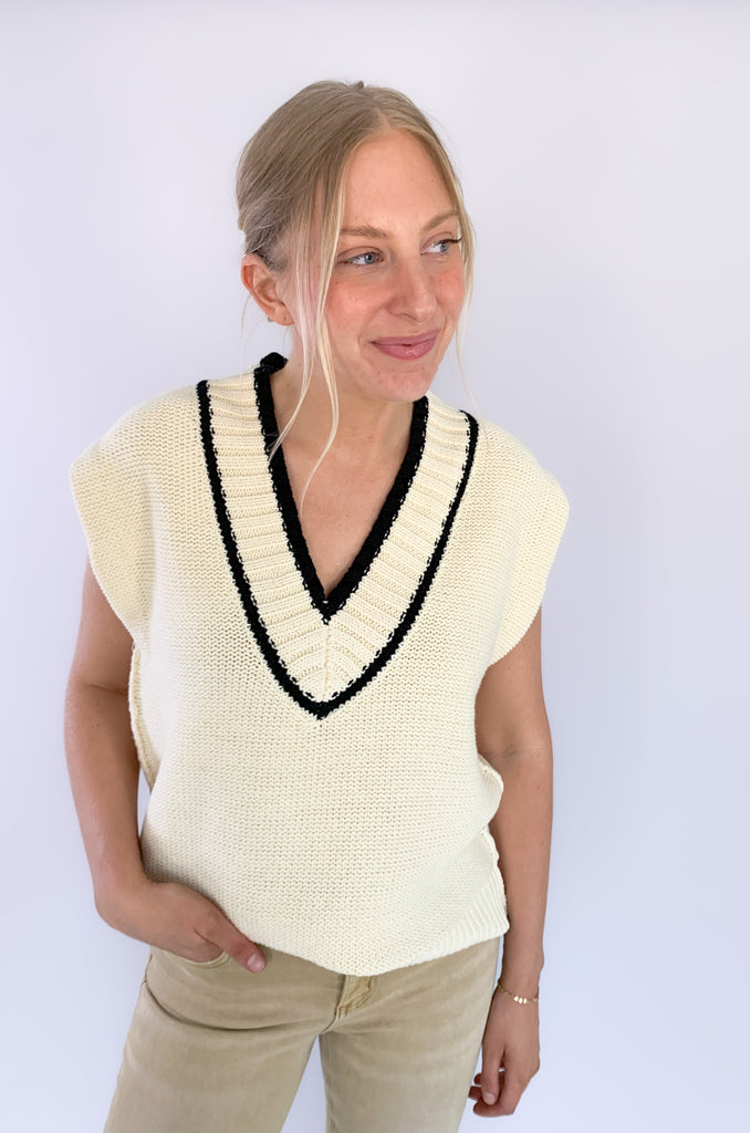 The Elan V Neck Varsity Sweater Vest is so chic and elevated! We love the cozy thick sweater material and contrast details. Round the v-neckline and bottom hem, there is contrast stitching. 