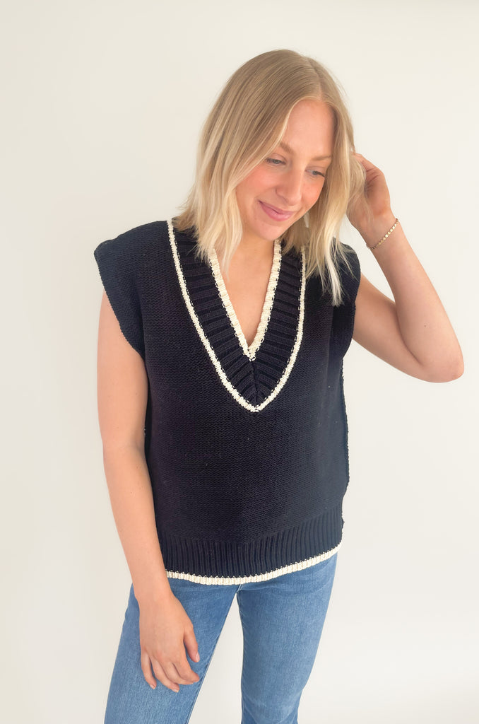 The Elan V Neck Varsity Sweater Vest is so chic and elevated! We love the cozy thick sweater material and contrast details. Round the v-neckline and bottom hem, there is contrast stitching. 