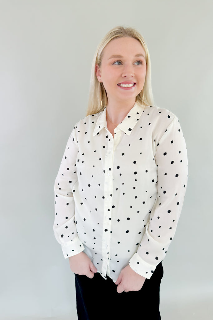 This stunning Vanilla Dot Button Front Long Sleeve Blouse is made from soft satin fabric for a luxurious feel. Made by Liverpool apparel, you know the quality and texture is amazing. Featuring an eye-catching polka dot design and smart button front, this stylish blouse is perfect for work or special occasions. 