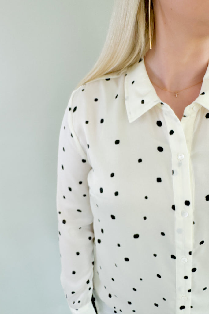 This stunning Vanilla Dot Button Front Long Sleeve Blouse is made from soft satin fabric for a luxurious feel. Made by Liverpool apparel, you know the quality and texture is amazing. Featuring an eye-catching polka dot design and smart button front, this stylish blouse is perfect for work or special occasions. 