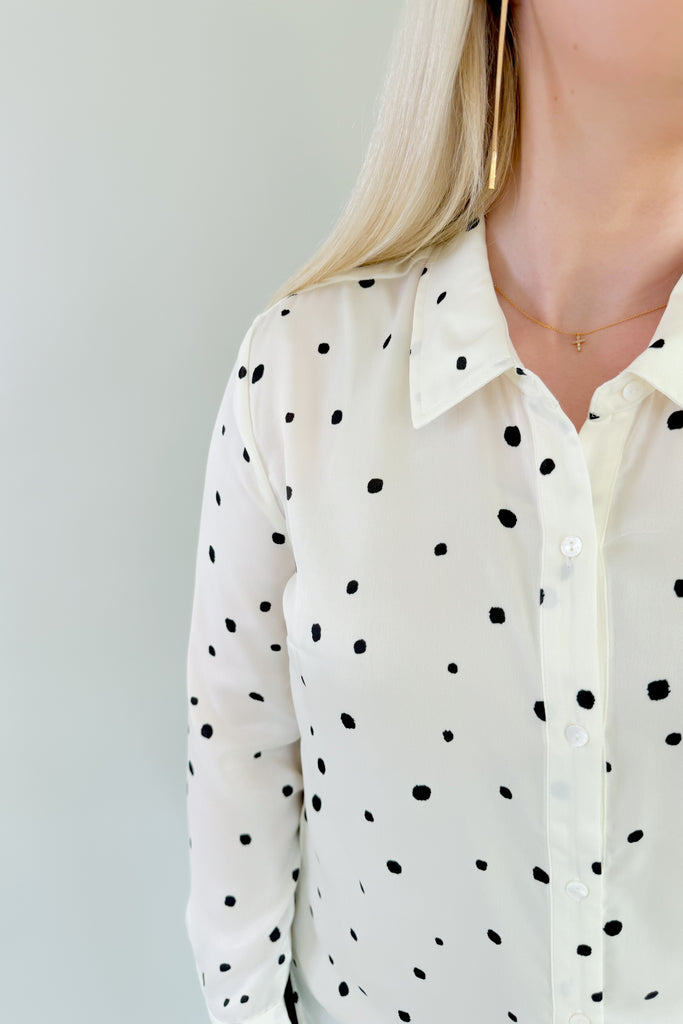 This stunning Vanilla Dot Button Front Long Sleeve Blouse is made from soft satin fabric for a luxurious feel. Made by Liverpool apparel, you know the quality and texture is amazing. Featuring an eye-catching polka dot design and smart button front, this stylish blouse is perfect for work or special occasions. 