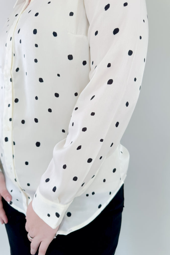 This stunning Vanilla Dot Button Front Long Sleeve Blouse is made from soft satin fabric for a luxurious feel. Made by Liverpool apparel, you know the quality and texture is amazing. Featuring an eye-catching polka dot design and smart button front, this stylish blouse is perfect for work or special occasions. 