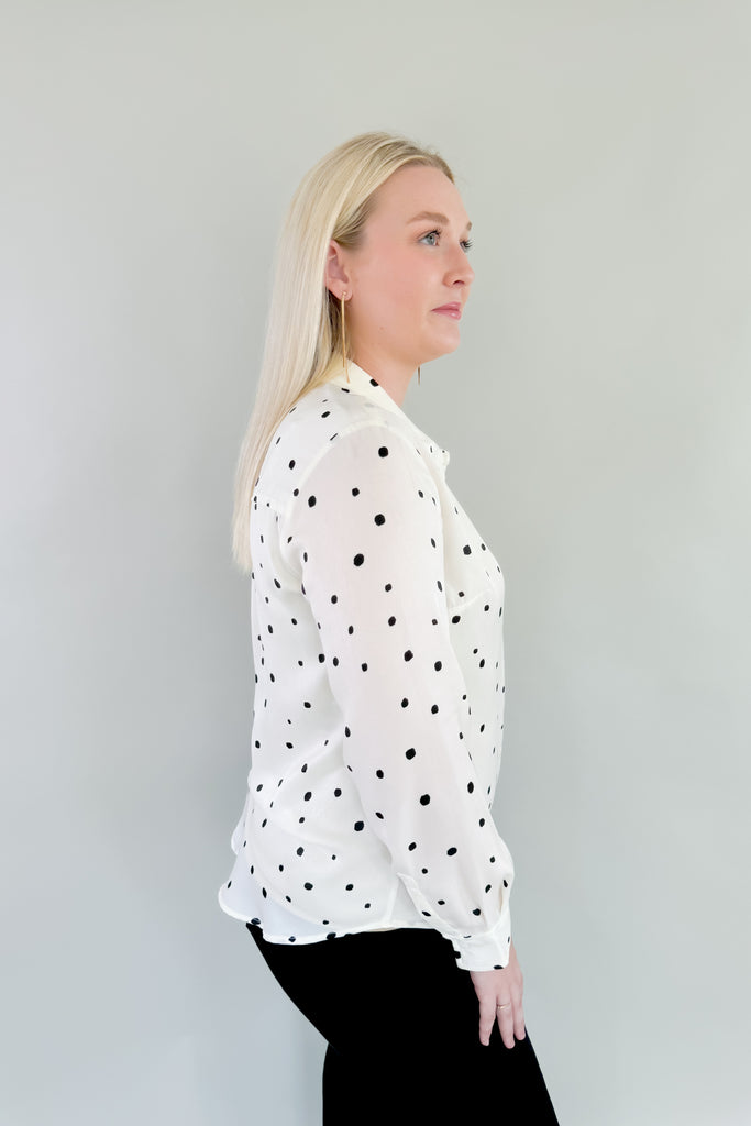 This stunning Vanilla Dot Button Front Long Sleeve Blouse is made from soft satin fabric for a luxurious feel. Made by Liverpool apparel, you know the quality and texture is amazing. Featuring an eye-catching polka dot design and smart button front, this stylish blouse is perfect for work or special occasions. 
