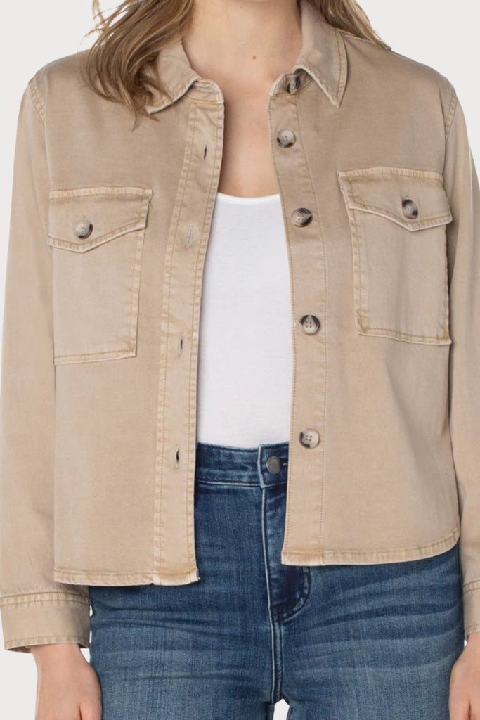A Liverpool Cropped Shirt Jacket is perfect for any occasion! A unique item that can be worn alone or on top of one our fabulous layering tanks. It's lightweight and the natural color pairs with everything!